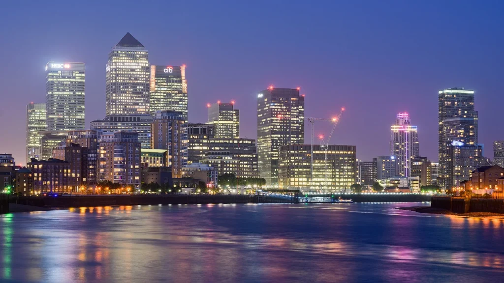 City skyline and water at dusk
